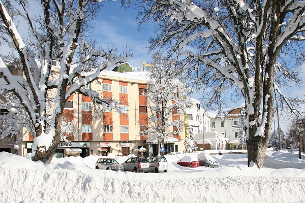 exterior of Grand Hotel Europa in the snow